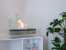 Etanolkamin för bord i elegant design med stål bas och glaspaneler