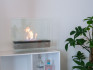 Etanolkamin för bord i elegant design med stål bas och glaspaneler